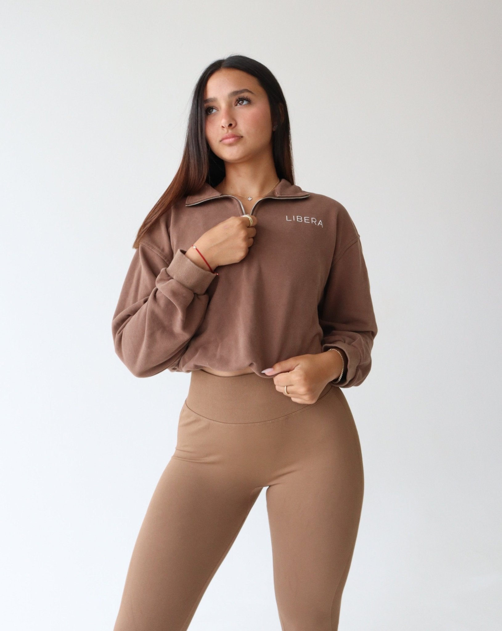 REFINE Quarter-Zip Sweater - MOCHA - LIBERA Fitness Apparel. Upgrade your comfort with our REFINE Quarter-Zip Sweater. Versatile and stylish design for any occasion.